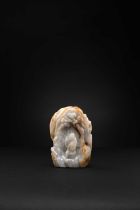A CHINESE GREY AND RUSSET JADE BOULDER QING DYNASTY The God of Longevity is depicted leaning on a