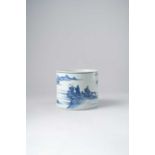 A CHINESE BLUE AND WHITE 'LANDSCAPE' BRUSHPOT, BITONG 18TH CENTURY Heavily potted, painted with a