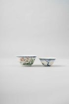 A CHINESE WUCAI 'CHICKEN' CUP AND A BLUE AND WHITE CUP KANGXI 1662-1722 The former delicately