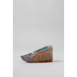A CHINESE FAMILLE ROSE MODEL OF A CHINESE SHOE LATE 18TH/19TH CENTURY Elaborately decorated with