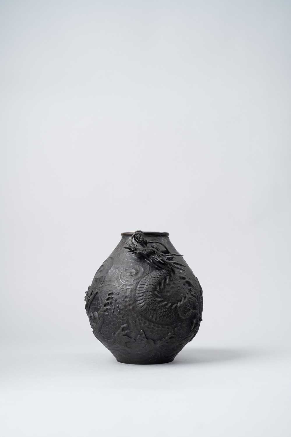 A JAPANESE BRONZE VASE MEIJI ERA, 19TH/20TH CENTURY The pear-shaped body decorated with a large