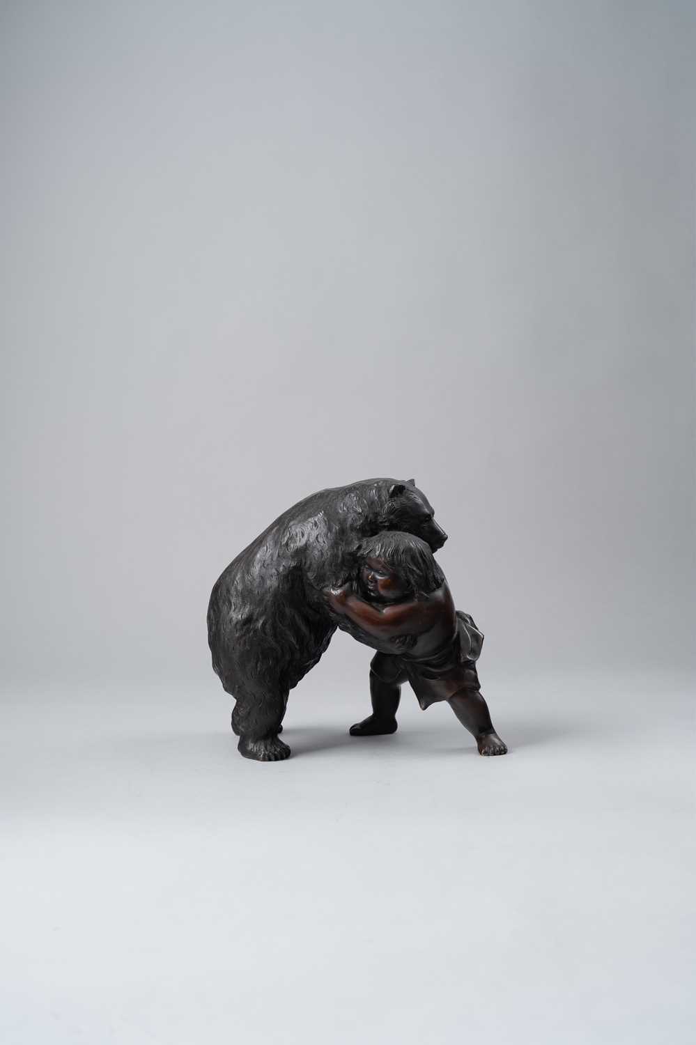 A JAPANESE BRONZE OKIMONO OF KINTARO AND A BEAR MEIJI ERA, 19TH/20TH CENTURY The legendary boy is