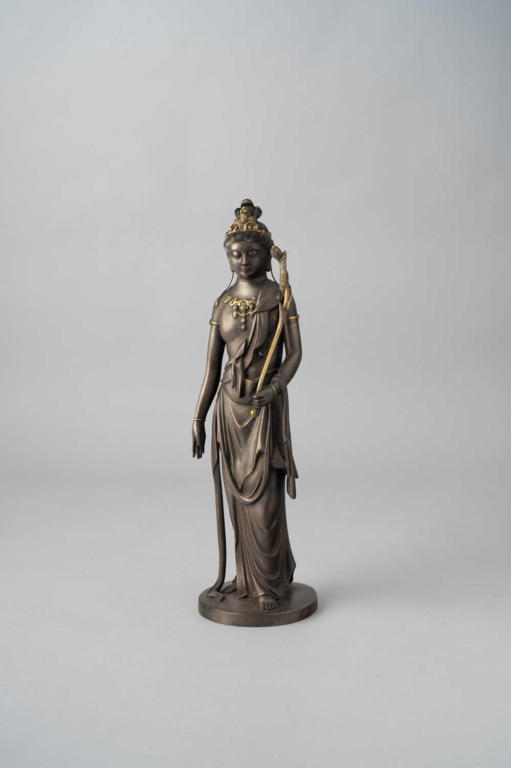 A JAPANESE PARCEL-GILT BRONZE OKIMONO OF KANNON BY TAKAMURA KŌUN (1852-1934) TAISHO/SHOWA, 20TH