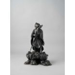 A LARGE JAPANESE BRONZE OKIMONO OF A SENNIN MEIJI ERA, 19TH CENTURY The sage is depicted wearing a