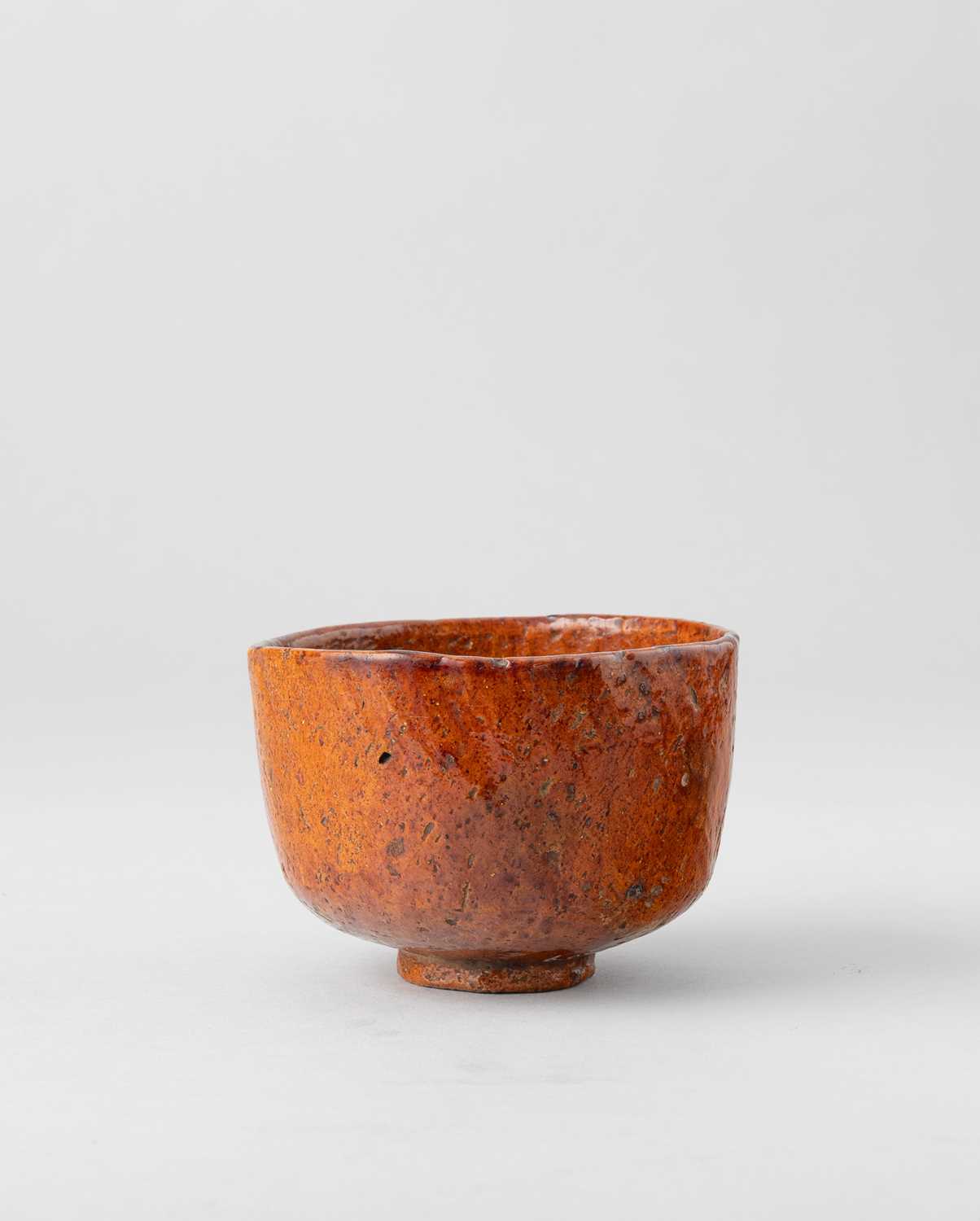 A JAPANESE OHI-YAKI RAKU CHAWAN (TEA BOWL) EDO PERIOD, 18TH-19TH CENTURY The U-shaped bowl raised on