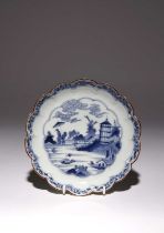 A JAPANESE ARITA 'VAN FRYTOM' DISH EDO PERIOD, C.1700 With a scalloped rim, the well decorated in