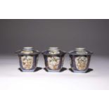 THREE JAPANESE CUPS AND COVERS EDO PERIOD, c.1690-1700 All decorated with panels enclosing