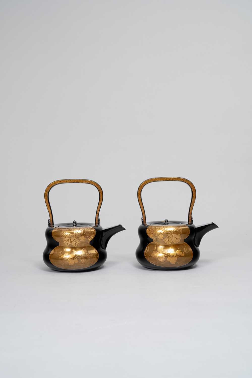A PAIR OF JAPANESE GOLD AND BLACK LACQUER CHOSHI (SAKE EWERS) MEIJI OR TAISHO, 20TH CENTURY Each