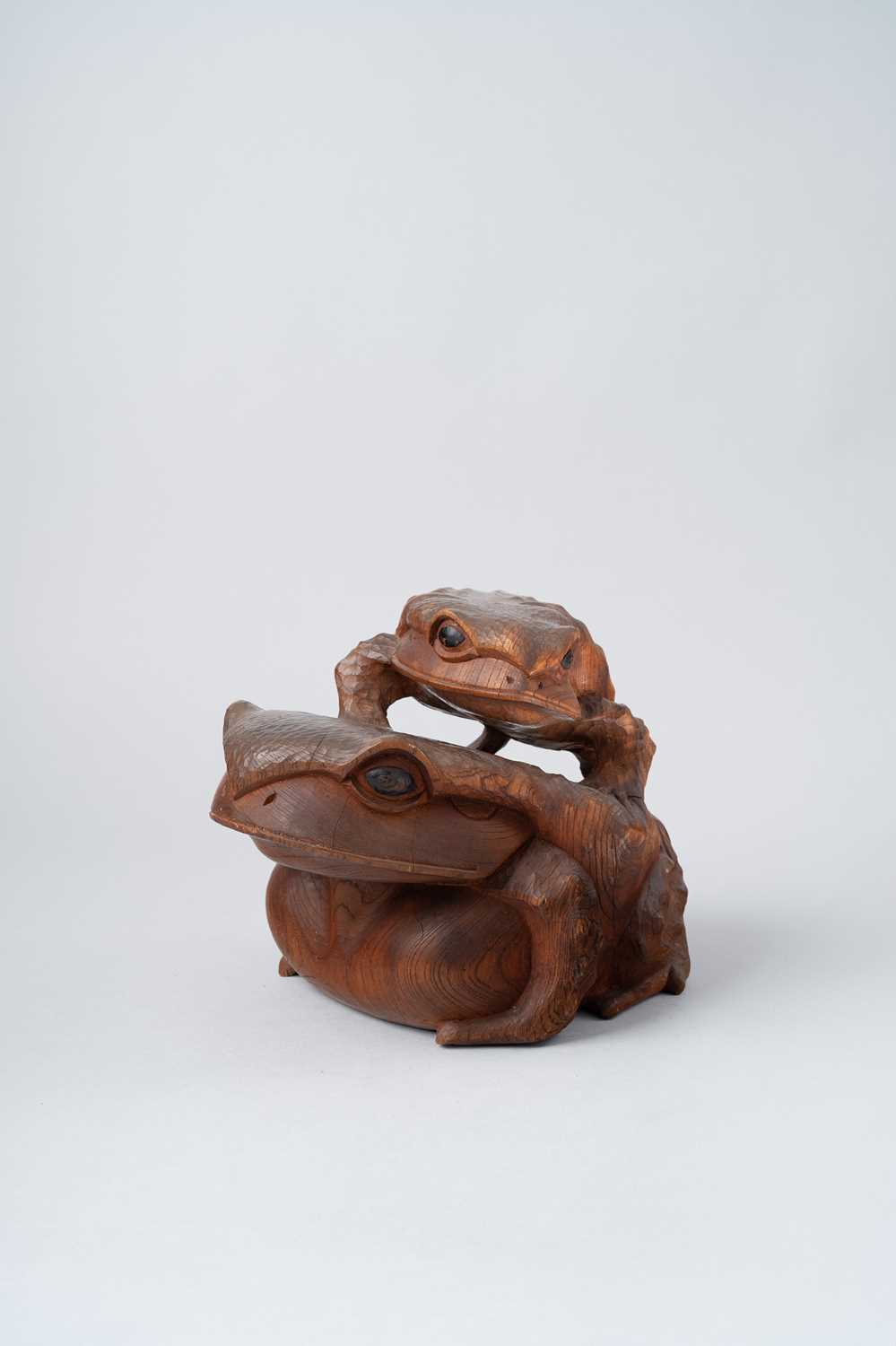 A LARGE JAPANESE WOOD OKIMONO OF TWO TOADS MEIJI OR LATER, 20TH CENTURY Carved from a single piece