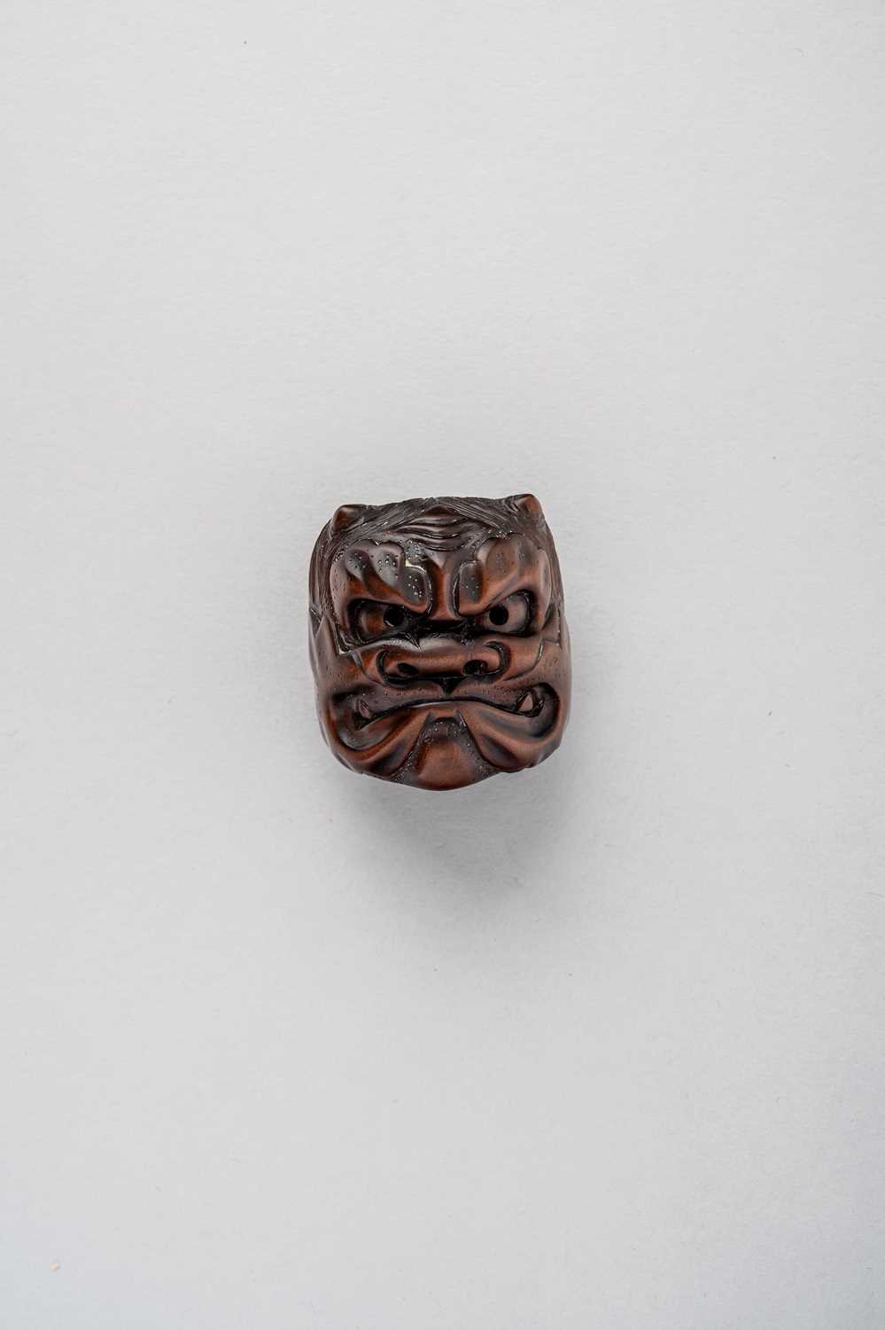 NO RESERVE A JAPANESE WOOD MASK NETSUKE OF AN ONI EDO/MEIJI PERIOD, 19TH CENTURY The reverse with