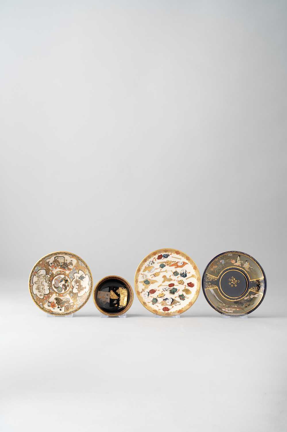 THREE JAPANESE SATSUMA SAUCERS MEIJI ERA, 19TH CENTURY One decorated with two panels respectively