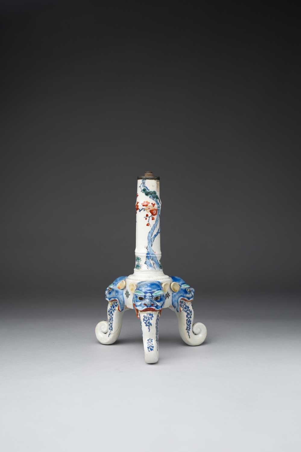 A JAPANESE KAKIEMON TRIPOD CANDLESTICK EDO PERIOD, 1660-80 The stem moulded as bamboo, painted