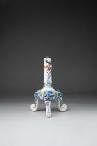 A JAPANESE KAKIEMON TRIPOD CANDLESTICK EDO PERIOD, 1660-80 The stem moulded as bamboo, painted