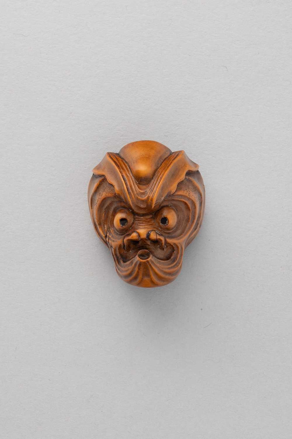 NO RESERVE A JAPANESE WOOD MASK NETSUKE OF AN OCTOPUS-USOFUKI EDO/MEIJI, 19TH CENTURY Depicted