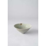 A KOREAN MOULDED CELADON BOWL POSSIBLY GORYEO, 13TH CENTURY OR LATER The interior carved with a