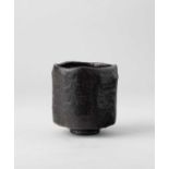 A JAPANESE BLACK RAKU CHAWAN (TEA BOWL) EDO PERIOD, 18TH-19TH CENTURY The tall cylindrical bowl