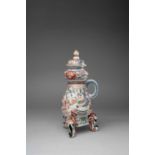 A LARGE JAPANESE IMARI CISTERN AND COVER EDO PERIOD, C.1700-1730 Of baluster form beneath a