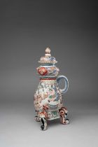 A LARGE JAPANESE IMARI CISTERN AND COVER EDO PERIOD, C.1700-1730 Of baluster form beneath a