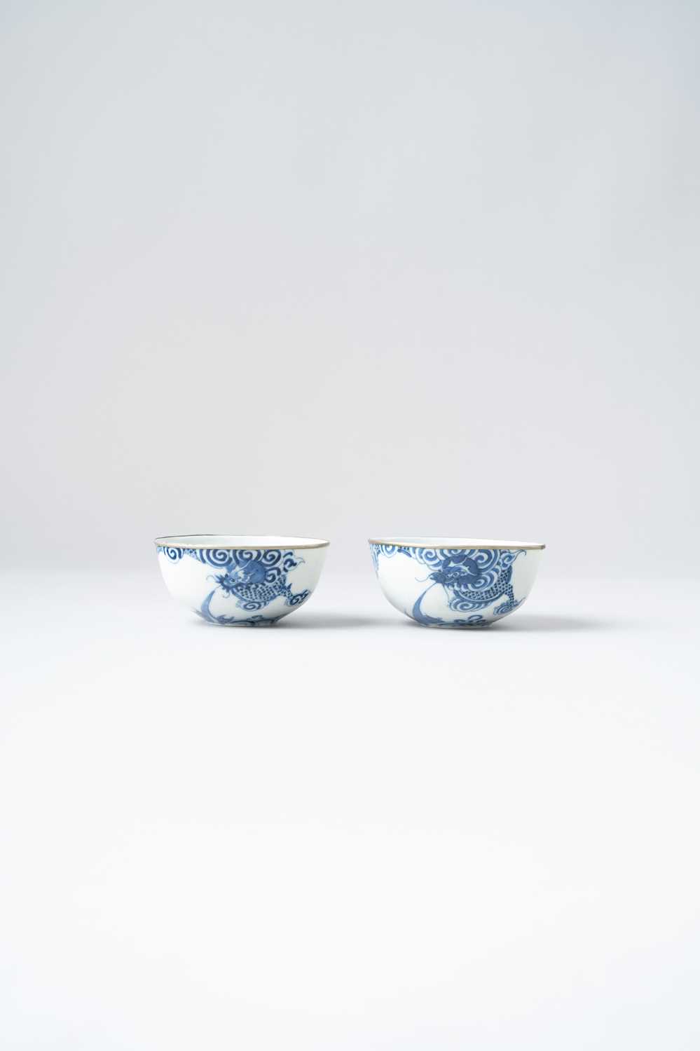 A PAIR OF CHINESE BLEU DE HUE 'DRAGON' BOWLS 19TH CENTURY For the Vietnamese market, each