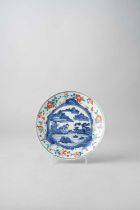 A JAPANESE KAKIEMON DISH EDO PERIOD, LATE 17TH/EARLY 18TH CENTURY The well decorated in underglaze