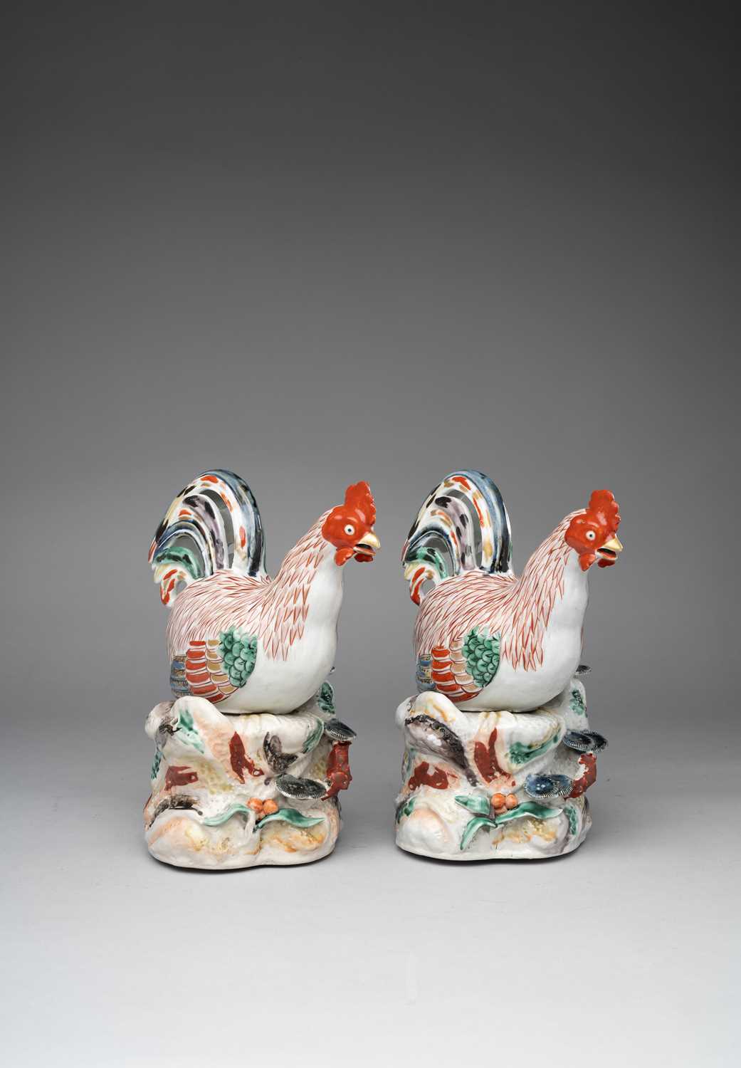 † † A PAIR OF JAPANESE ARITA MODELS OF CHICKENS EDO PERIOD, C.1670-1730 Depicted standing on