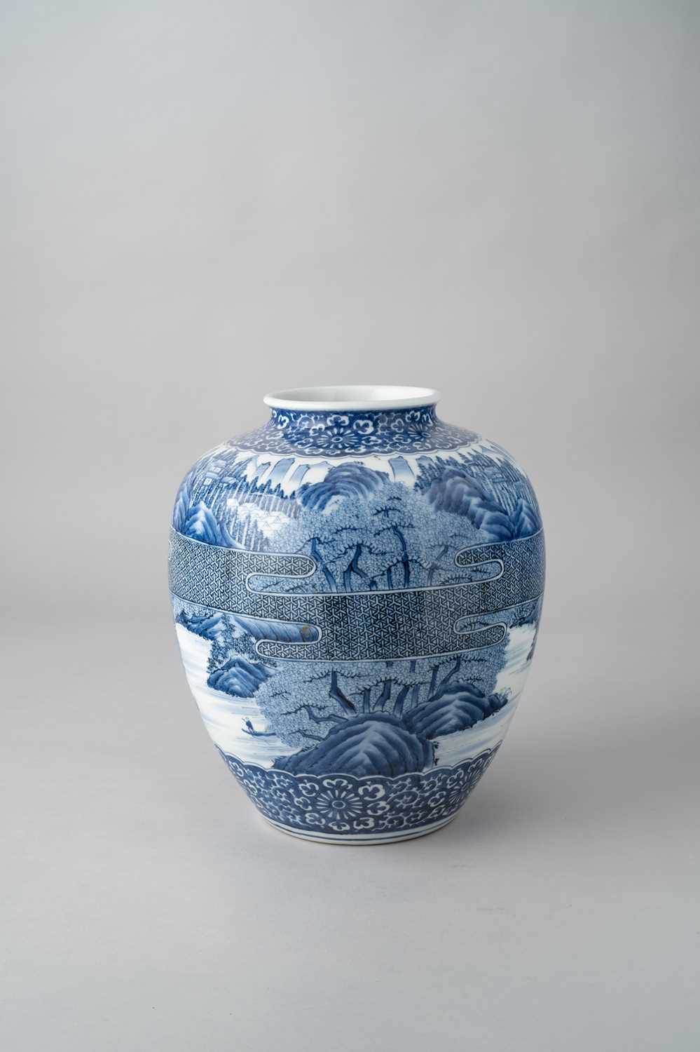 A LARGE JAPANESE BLUE AND WHITE VASE MEIJI OR LATER, 20TH CENTURY The bulbous body densely decorated