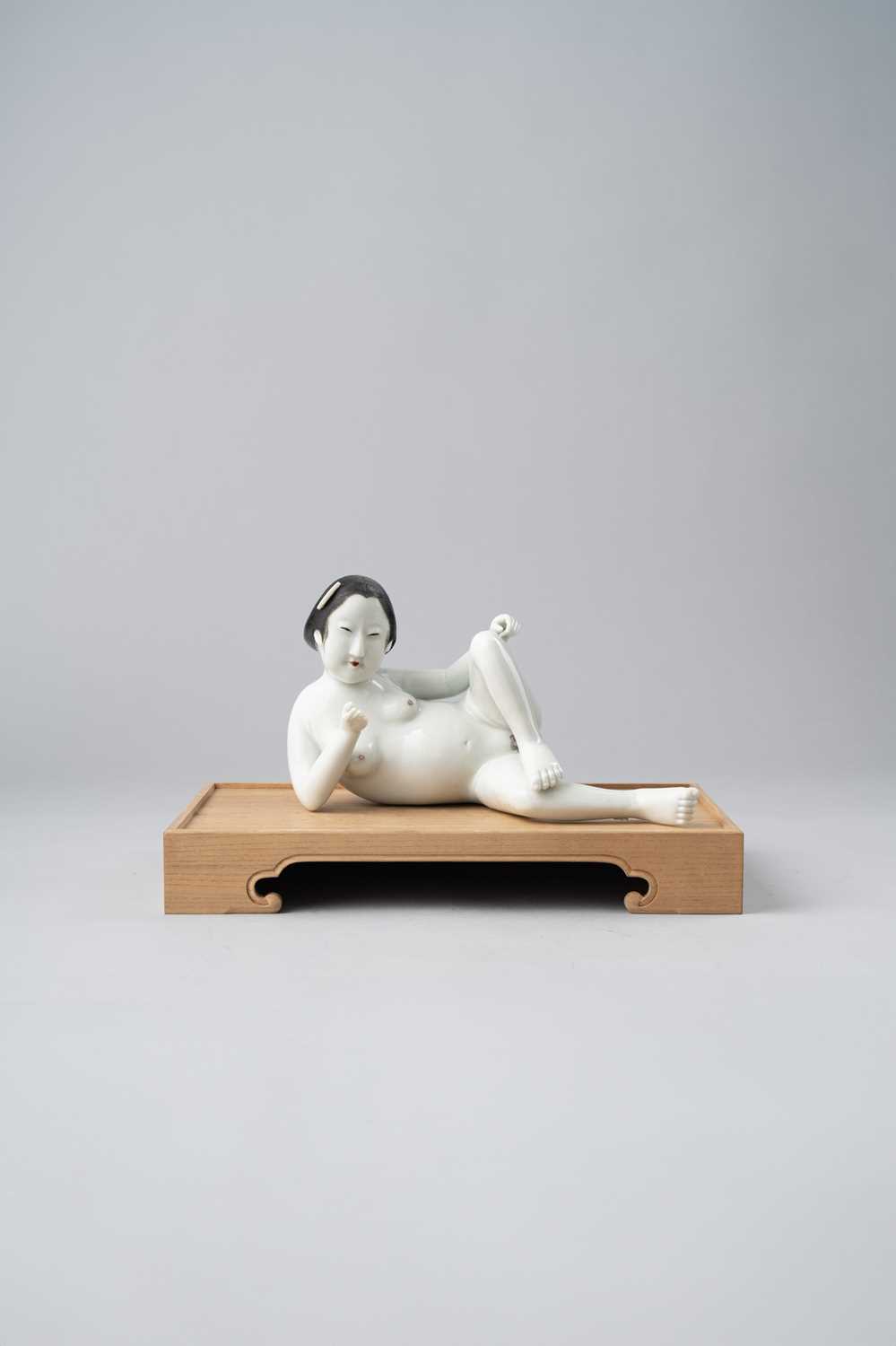 AN UNUSUAL JAPANESE OKIMONO OF A RECLINING NUDE MEIJI OR LATER, 19TH CENTURY Possibly Hirado, the