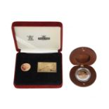 Elizabeth II, gold sovereign, 2001, bullion type (S 4430), cased together with a gilt-metal ingot;