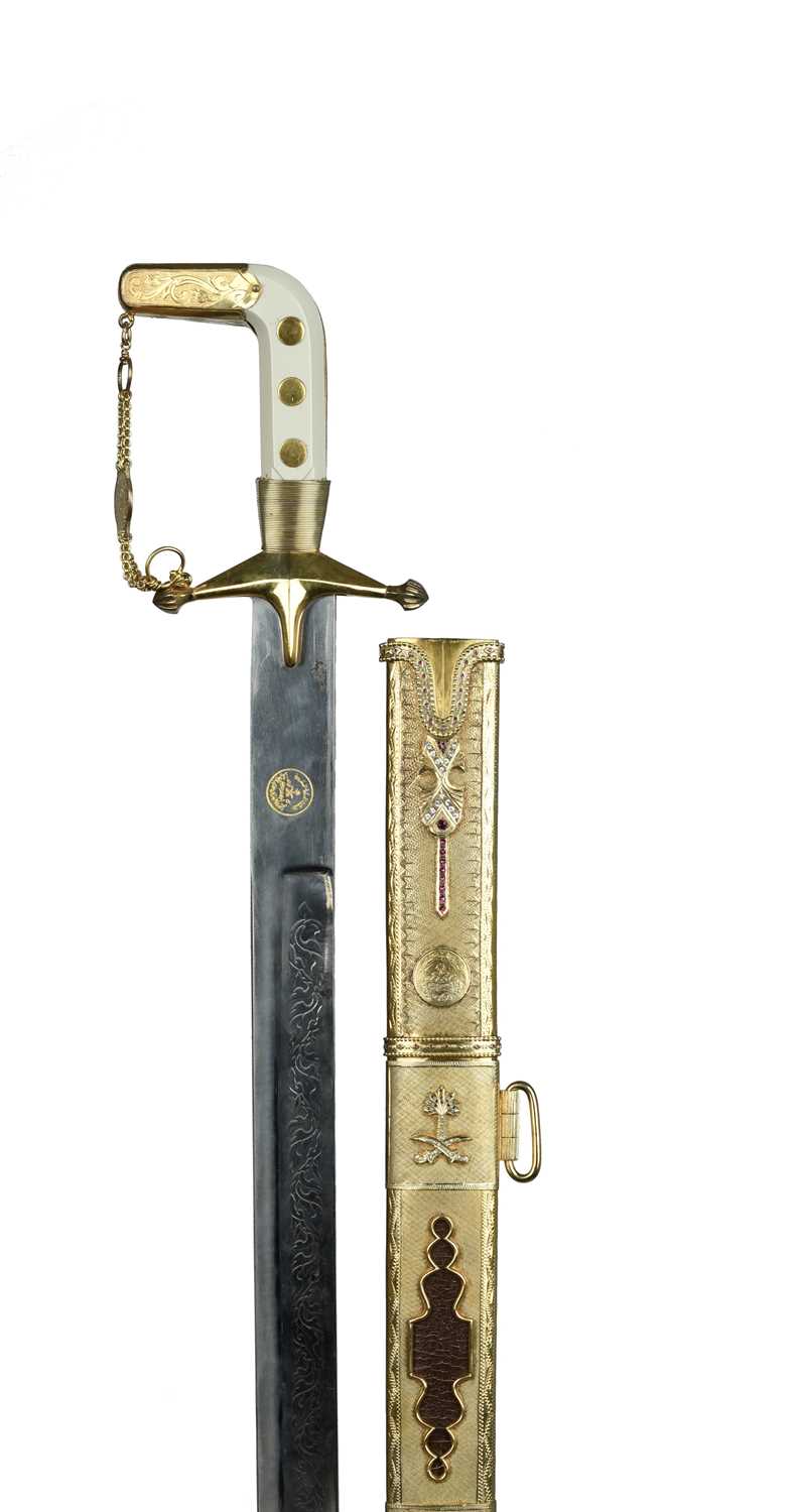 Saudi Arabia: a presentation sword (saif), the blade 36 in, nearly straight with a single broad