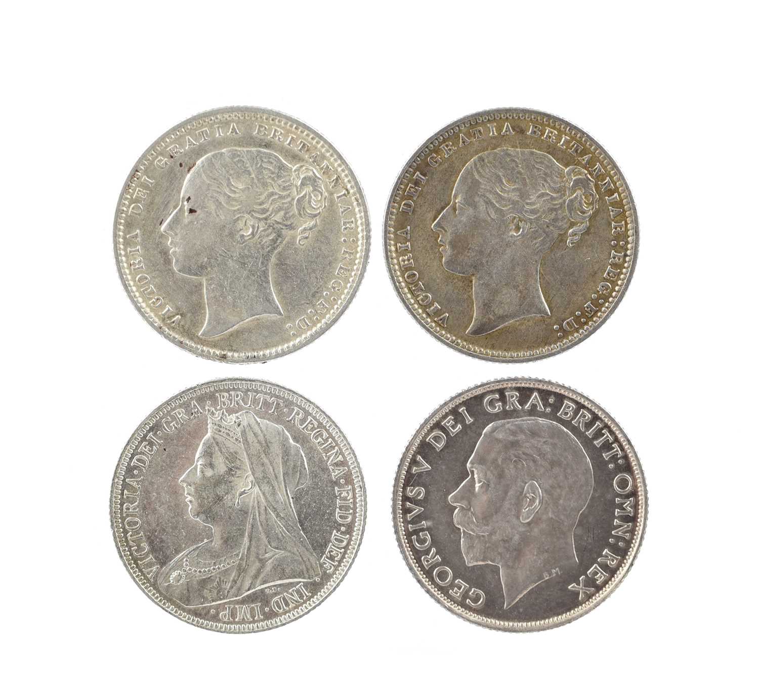 Four silver shillings, vis.: Victoria, 1873 and 1877, die number 73 and 33 (S 3906A), both near very