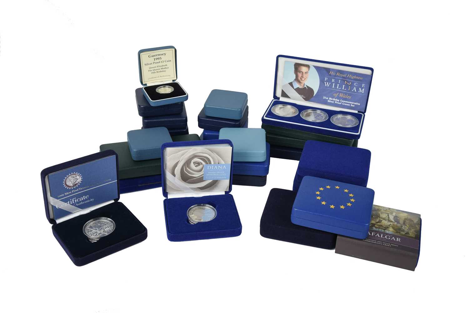 Elizabeth II: a quantity of cased silver proof coins, pairs and singles, including: 80th Birthday