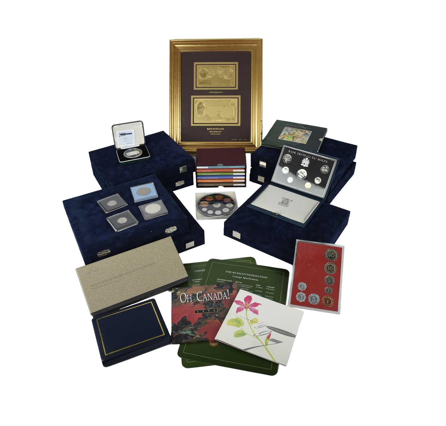 A quantity of overseas proof coin sets, silver stamp issues, a framed pair of gold leaf bank