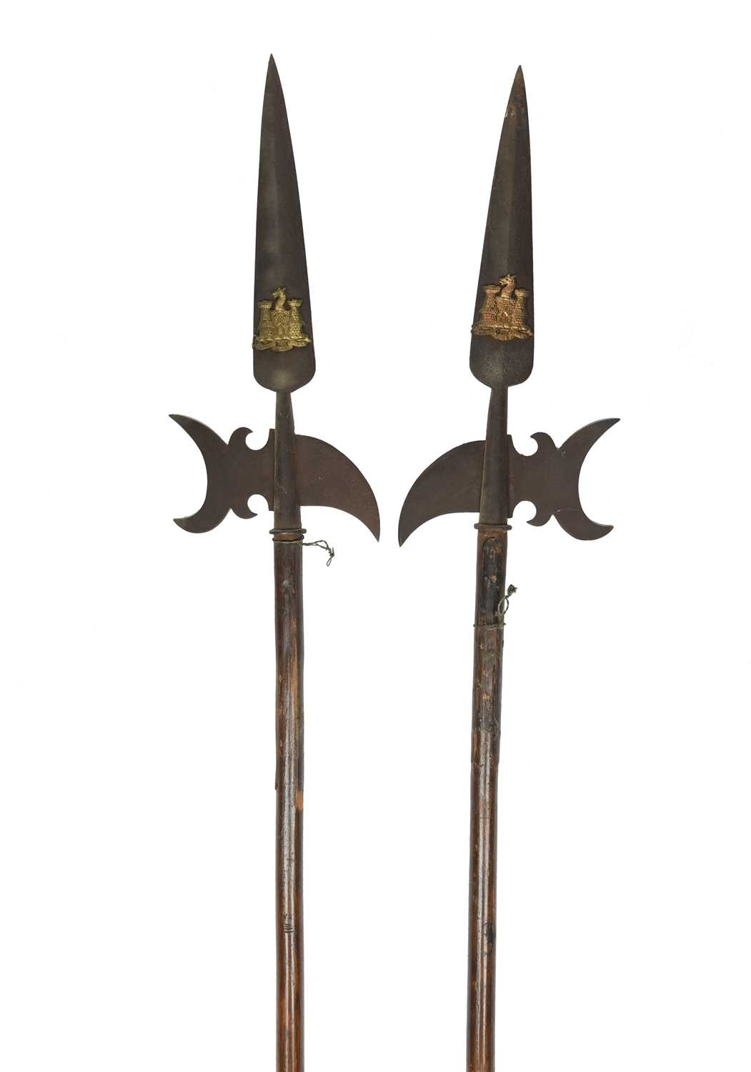 A pair of ornamental halberds, heads with crescent-shaped axe blades and curved rear spikes and