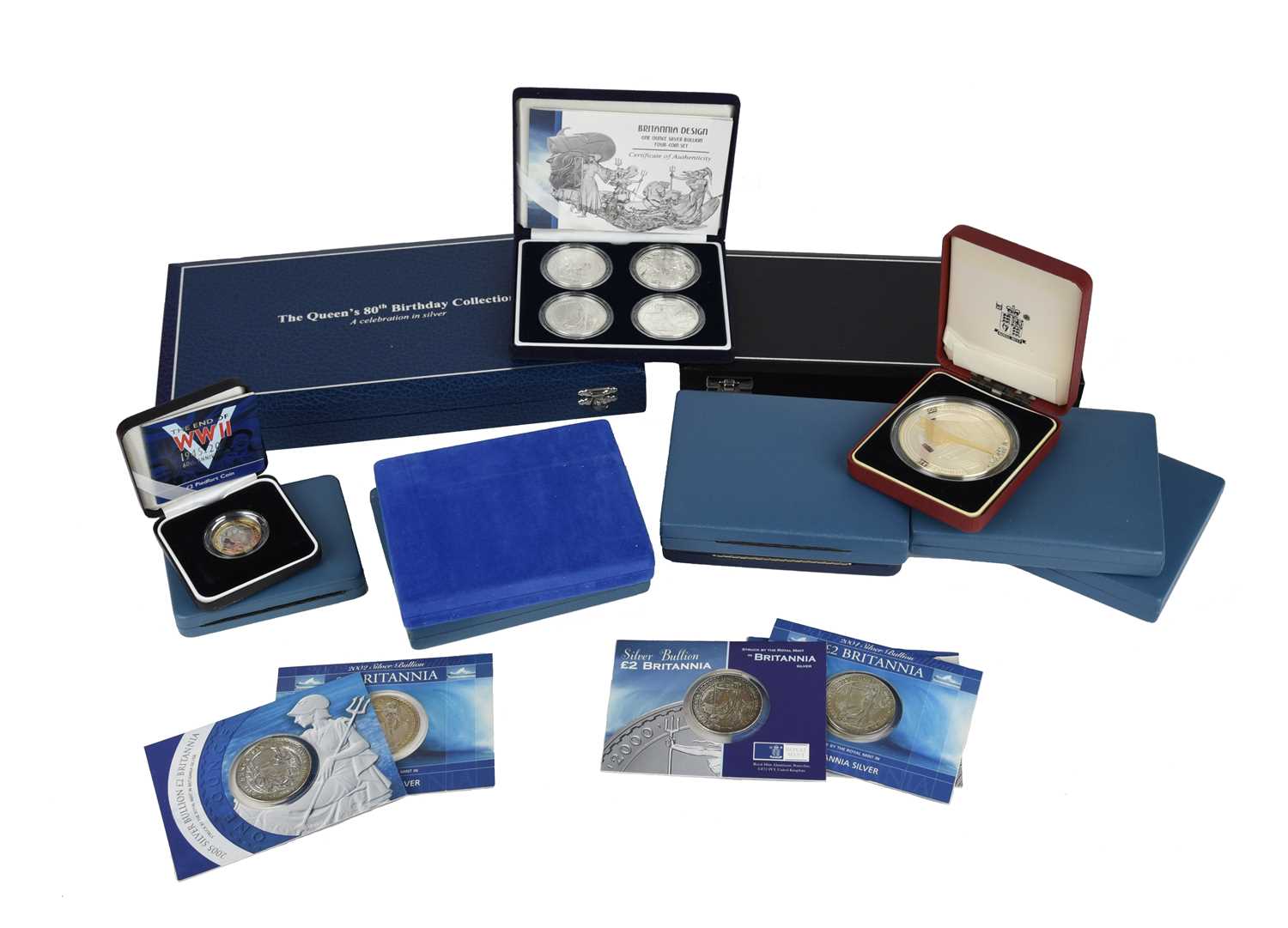 Elizabeth II: a quantity of silver proof coin sets and singles, including: The Queen's 80th Birthday