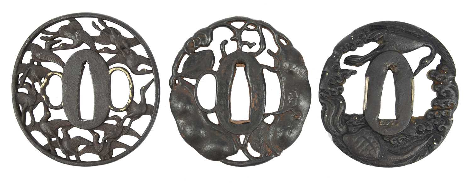 A collection of Japanese sword fittings, comprising: Three Japanese iron sword guards (tsuba), - Image 9 of 15