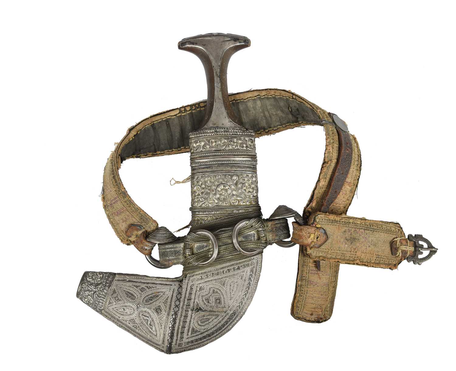 λ An Omani dagger (jambiya), broad curved blade 6.5 in. rhinoceros horn hilt with embossed silver