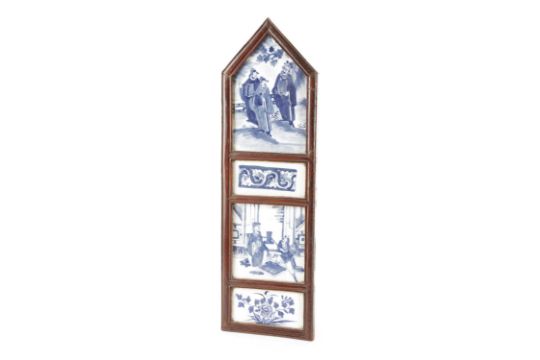 A CHINESE PANEL 18TH / 19TH CENTURY the lacquered wood arched frame containing four blue and white