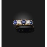 A late 19th century sapphire and diamond five stone ring, set with sapphires and diamonds in