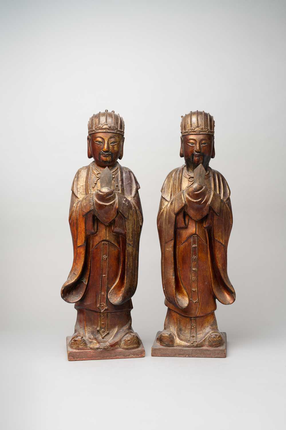 A PAIR OF CHINESE GILT-LACQUERED WOOD FIGURES OF OFFICIALS 19TH/20TH CENTURY The bearded figures