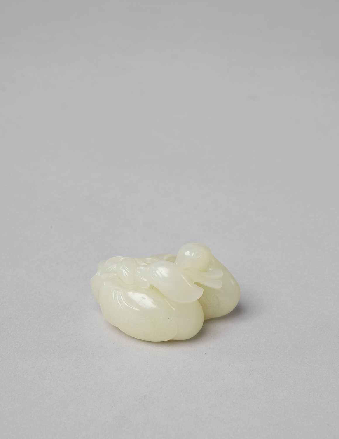 A CHINESE WHITE JADE 'MANDARIN DUCK' GROUP QING DYNASTY OR LATER The two birds huddled together