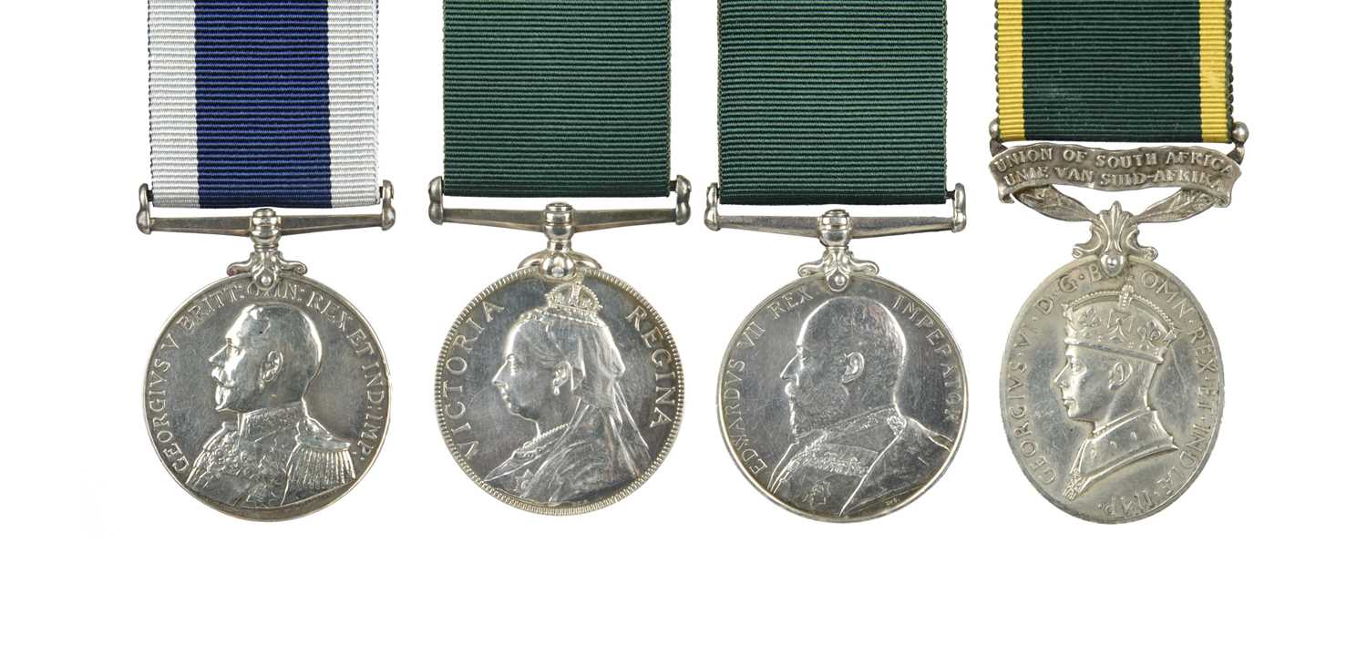 Long Service Medals (4): Royal Navy, George V, swivelling suspension, re-named in engraved