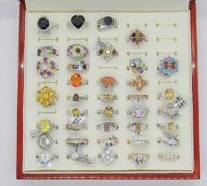 Collection of gem set silver dress rings, to include several multi gem rainbow cluster examples,