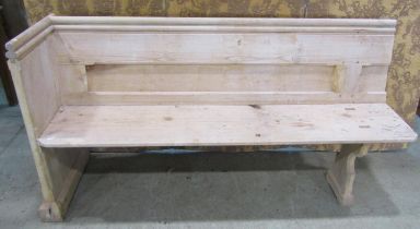 A stripped pine church pew, with moulded and chamfered frame and single shaped end, 62cm long (later