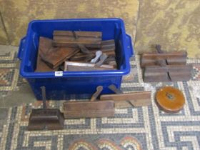 A box of vintage carpentery moulding planes and a Chesterman’s leather land tape