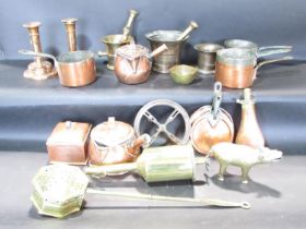 A mixed selection of copper ware, including a tea caddy, a pair of candlesticks, a powder horn,