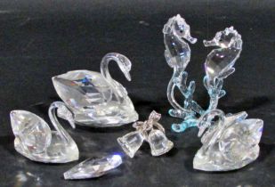 Glassware consisting of Swarovski bells, two swans (as found) and two seahorses, a pair of Edinburgh