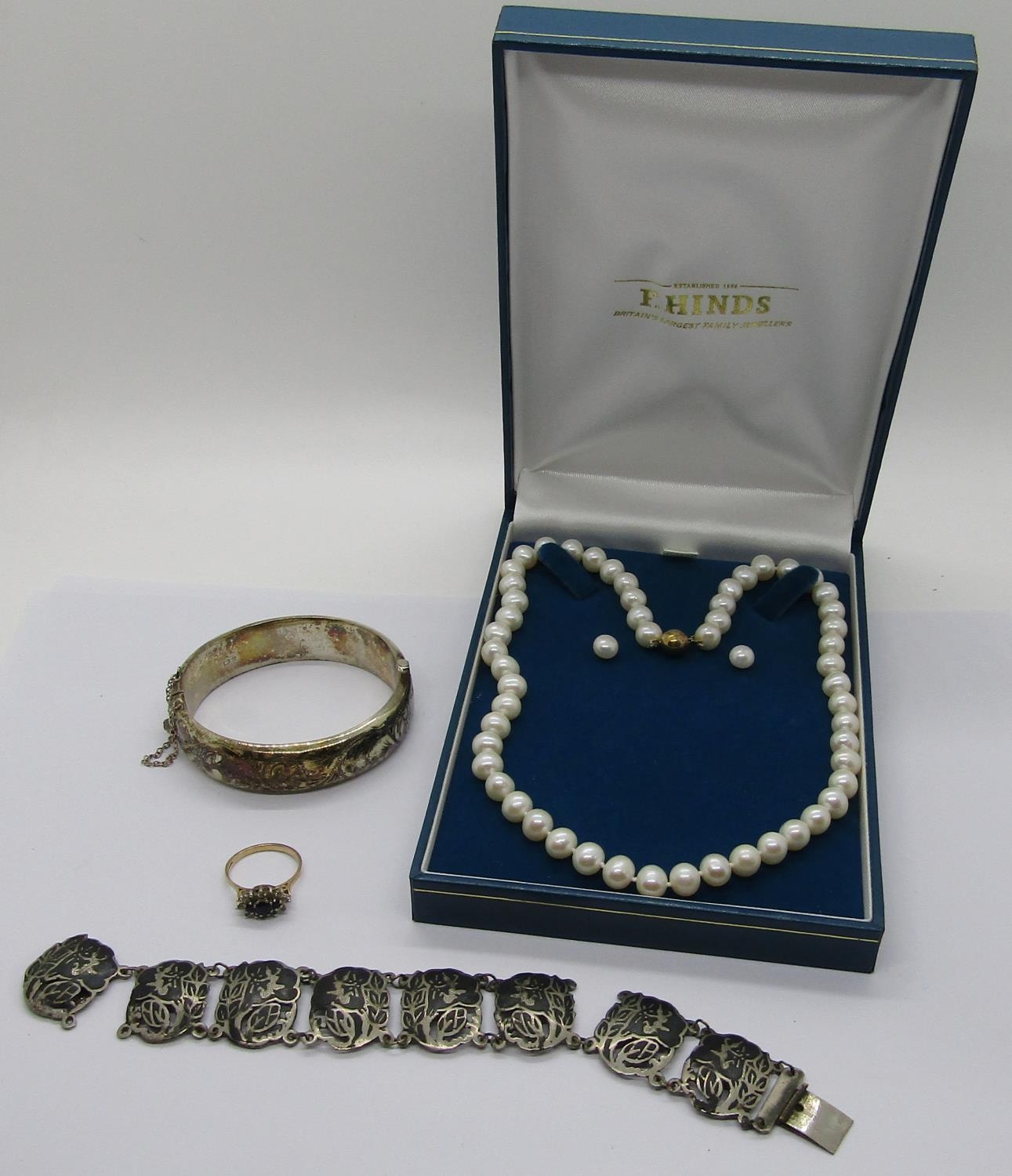 Mixed group of jewellery comprising a 9ct CZ dress ring, a 9ct pearl necklace and matching pair of