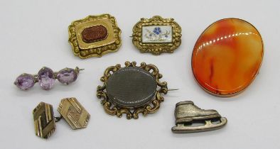 Group of antique brooches comprising a Victorian yellow metal mourning brooch containing woven hair,