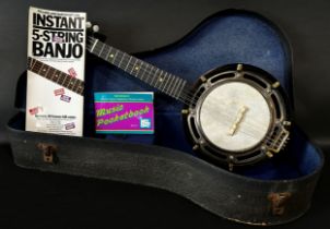 A mandolin/miniature eight string banjo, in a hard carry case