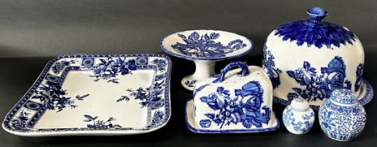 Collection of blue and white transfer printed ware including a cheese bell and stand, outsized